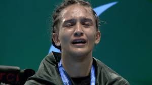 "Bano Butt celebrates her MMA championship win with a triumphant pose"