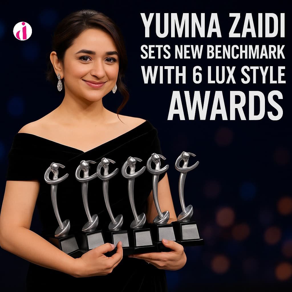 Yumna Zaidi proudly holding six Lux Style Awards, smiling in a black velvet gown.