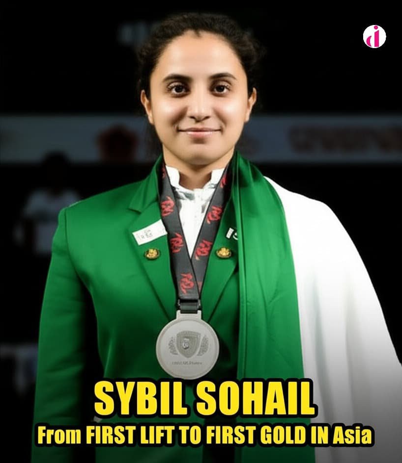 Pakistani weightlifter Sybil Sohail proudly poses with a medal around her neck, wearing a green blazer and representing Pakistan.